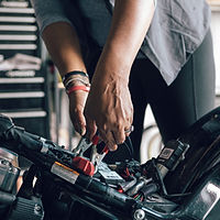 Mechanic Repairing Motorcycle