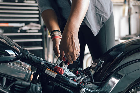 Mechanic Repairing Motorcycle