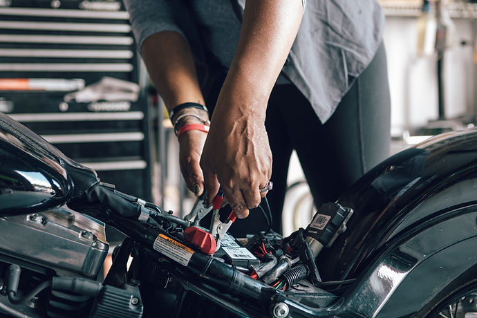 Mechanic Repairing Motorcycle