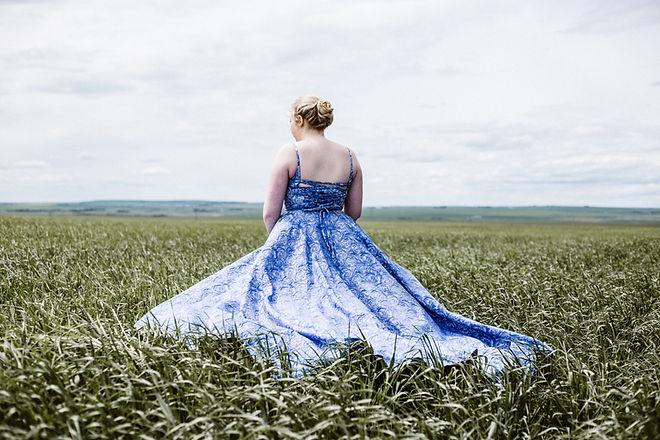 Running Through the Field in a Dress