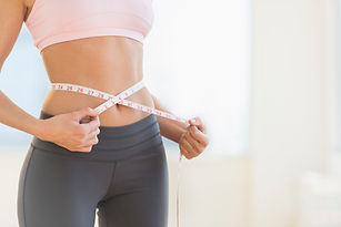 Woman measuring waist