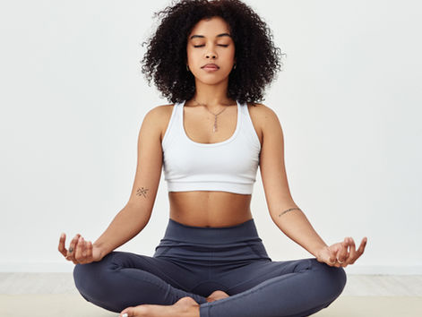 Woman meditating on the ground