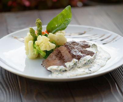 Beef fillet with vegetables and herb sauce