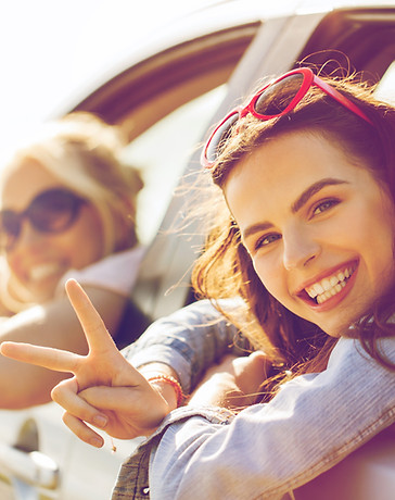 Women in car smiling
