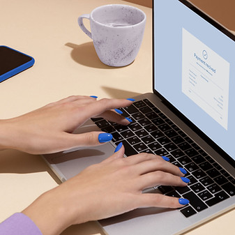 Person using a laptop, showcasing the flexibility of online English learning sessions offered by Speak On English