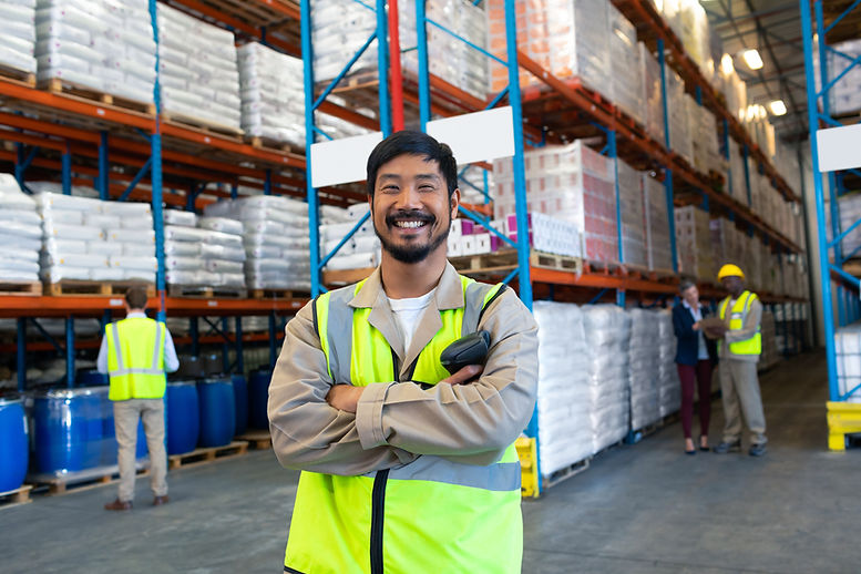 Smiling Worker in Warehouse