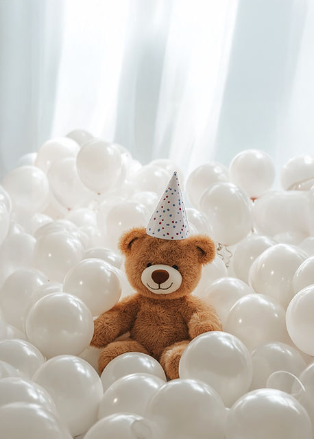 Osito de peluche con globos