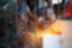 Worker cutting a piece of steel