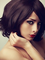 Beautiful makeup model with short black haircut and vamp look