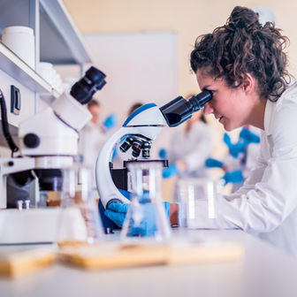 Life Sciences Professional with Microscope