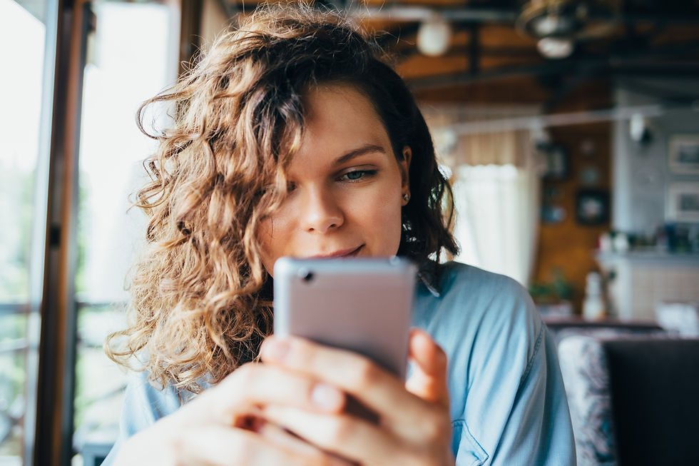 girl scrolling social media on cellphone
