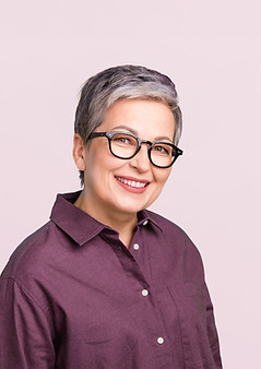 Smiling Person with Glasses