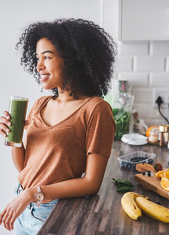Woman drinking green smoothie