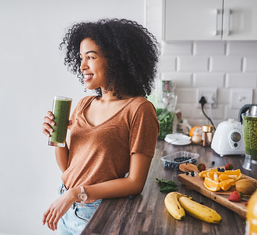 Woman drinking green smoothie