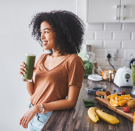 Woman drinking green smoothie