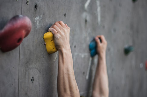 Hands on the Climbing Wall