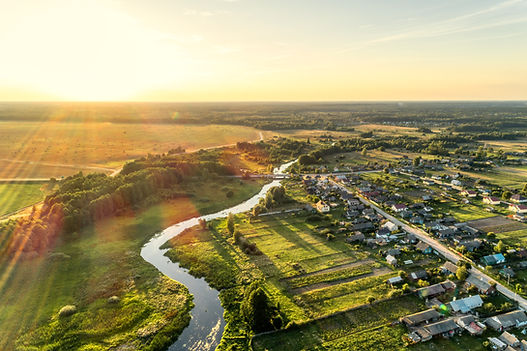 Wide angle view of a vibrant community park with families enjoying outdoor activities