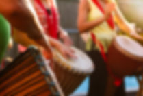 People Playing Djembe