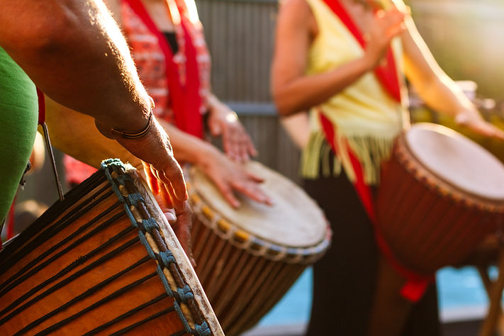 People Playing Djembe