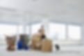 Businesswoman in Office with Moving Supplies
