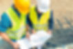 construction site manager dealing with blueprints and projects