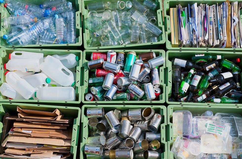 Recycling crates filled with sorted plastic bottles aluminium cans and glass bottles