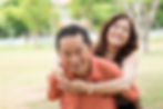 Asian husband piggyback his wife