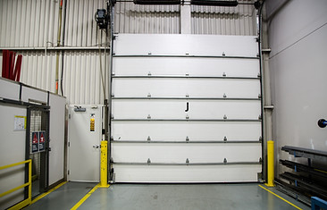 Garage door seen from within a warehouse