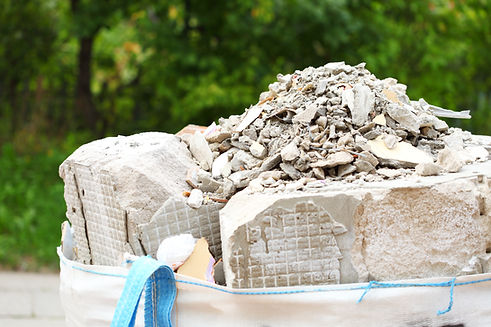 Full construction waste debris bags, garbage bricks, pile of rubble and material from demo