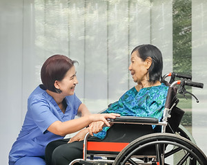 Nurse and Patient on Wheelchair