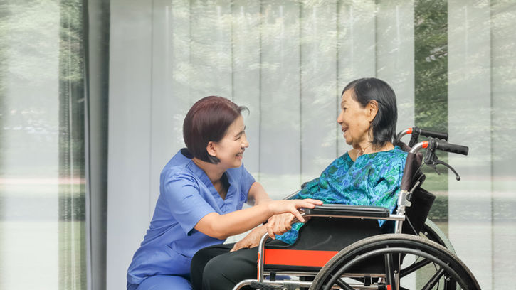 Nurse and Patient on Wheelchair