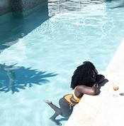Woman Relaxing Poolside