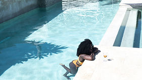 Woman Relaxing Poolside