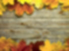 autumn leaves on a wooden table