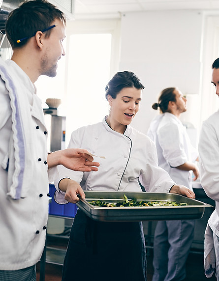 Chefs Discussing over Food