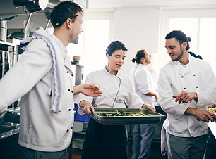 Chefs Discussing over Food