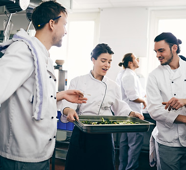 Chefs Discussing over Food