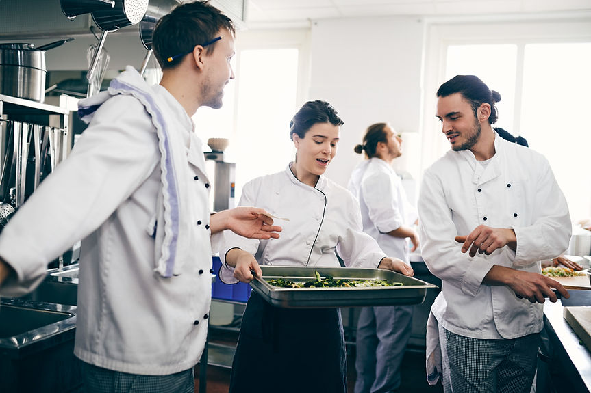 Chefs Discussing over Food