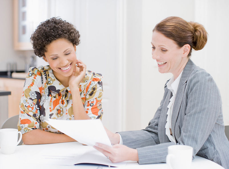 Woman reviewing paperwork with financial advisor