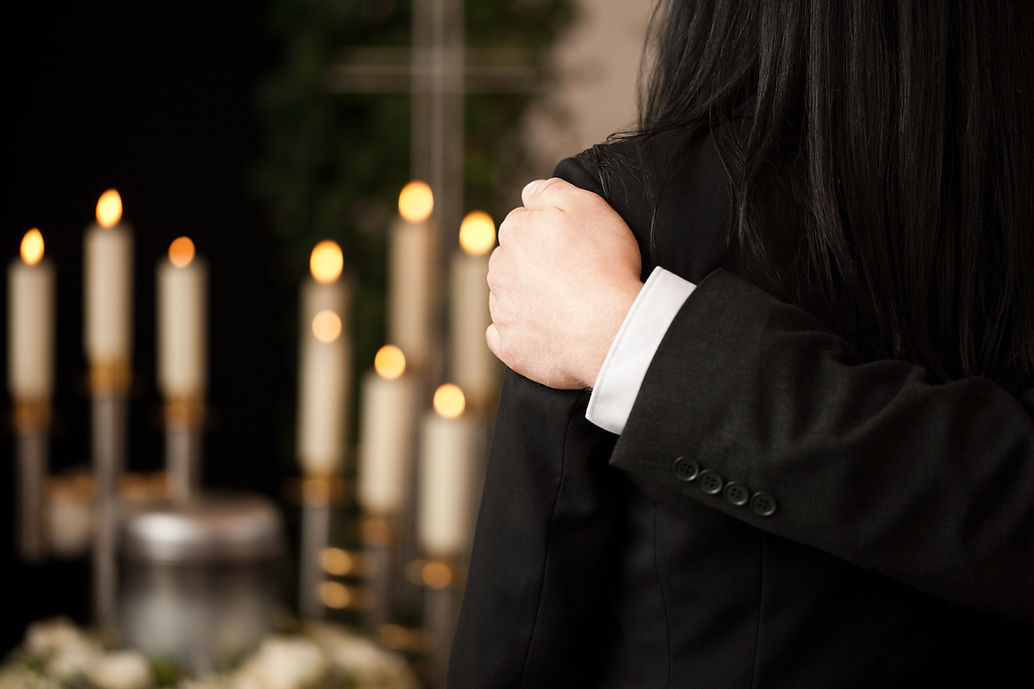 Mourner at a funeral wearing black