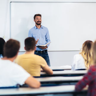 Image of teens in a classroom looking at a teacher. Learn how therapy for teens in New York, NY can help teens overcome pre-college anxiety. | teen counseling in new york, ny | therapy for teens in manhattan, ny | therapy for teens in new york, ny | teen therapist in new york, ny | anxiety in teens | 10002 | 11201 | 11215