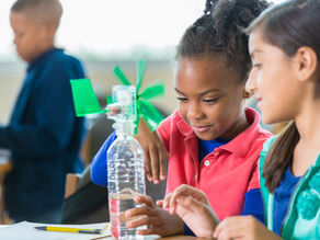 Two students exploring STEM activities in classroom.