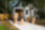 Moving van with cardboard box and chairs by house