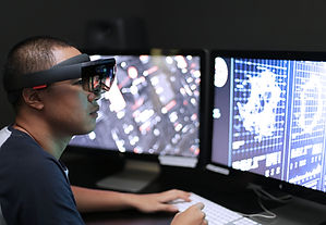 Man playing virtual reality with Microsoft HoloLens