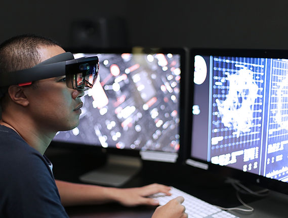 Man playing virtual reality with Microsoft HoloLens