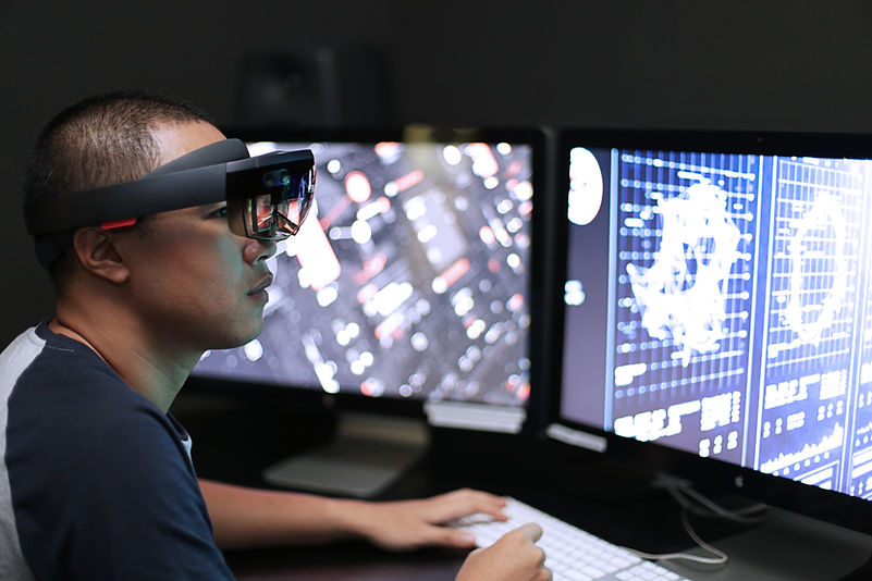 Man playing virtual reality with Microsoft HoloLens