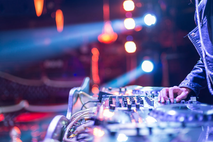 sound console and a person's hand at an event