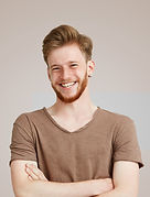 Smiling in Brown Shirt