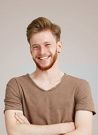 Smiling in Brown Shirt