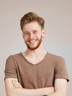 Smiling in Brown Shirt